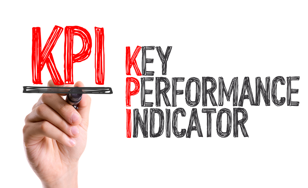 Hand with marker writing KPI Hand with marker writing KPI